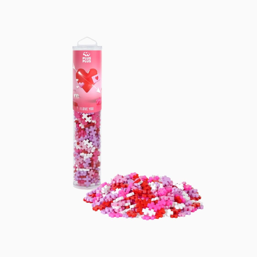 PlusPlus tube met constructie speelgoed in de kleuren roze, rood en wit