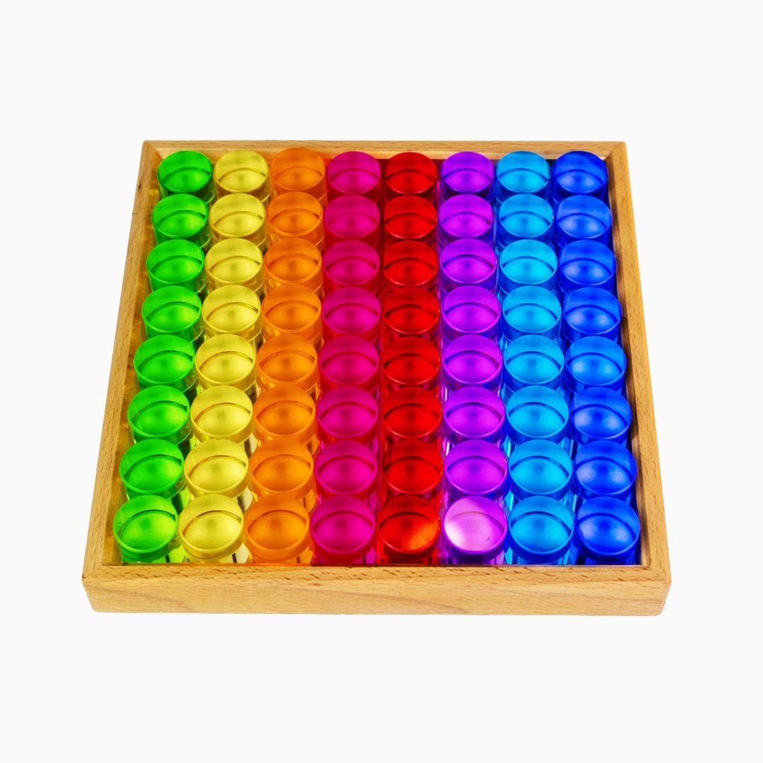 Bauspiel set met 64 licht doorlatende cilinder blokken van acryl in houten frame