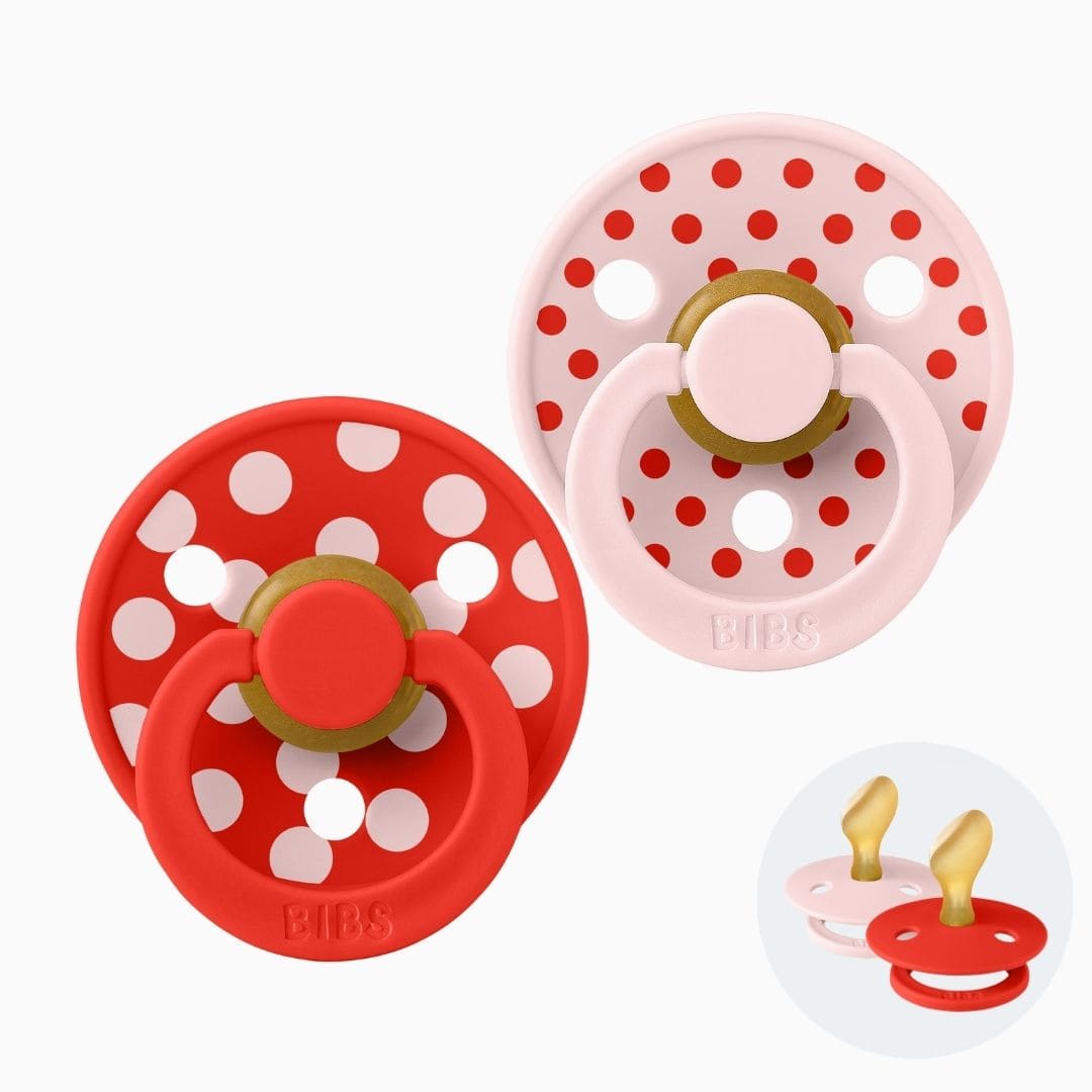 bibs studio dental fopspeen met orthodontische speen van latex met rond schild met stipjes dessin in roze en rood