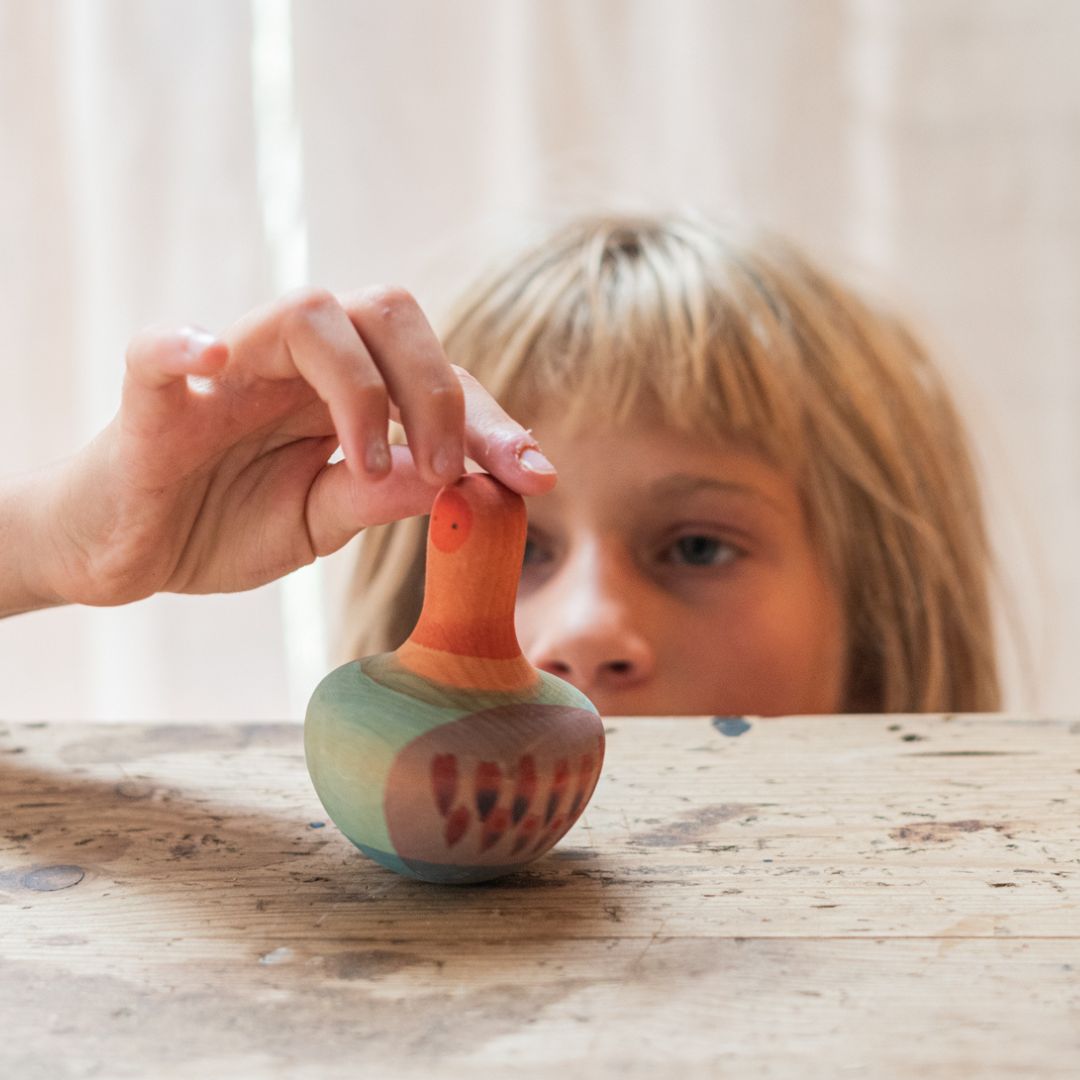 Grapat houten speelgoed tol Mellow orange Bird