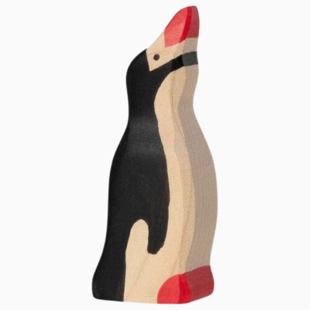 Holztiger baby pinguin met kop omhoog
