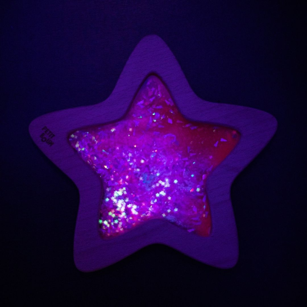 Petit Boum sensorisch speelgoed ster met fluorescerende vloeistof en glitters