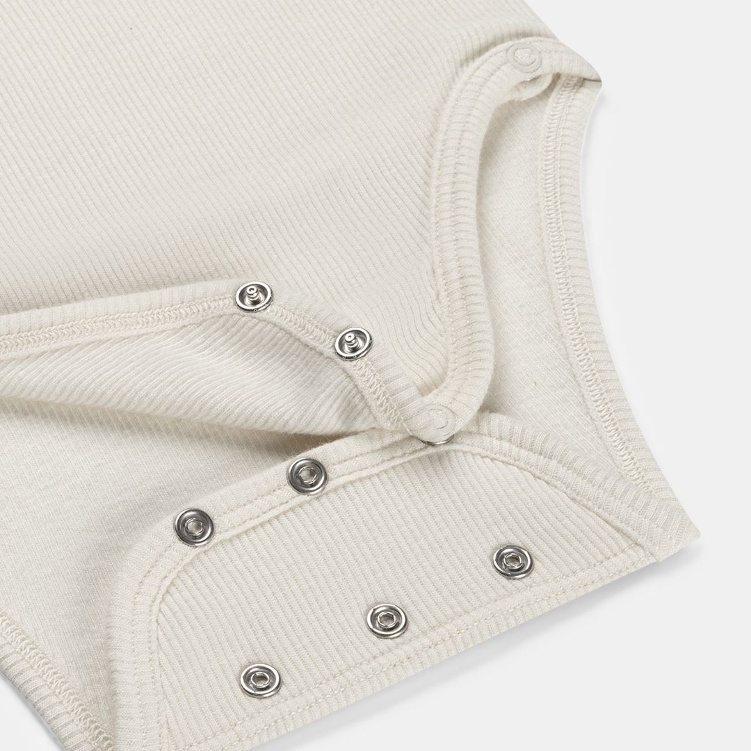 Wikkelromper Romp & Roll wit