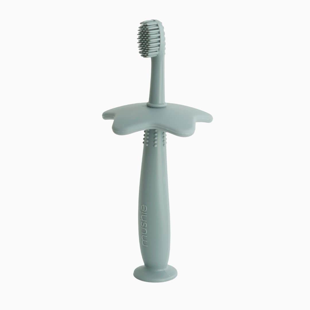 Mushie eerste tandenborstel van siliconen voor kinderen om te oefenen in de kleur oudgroen