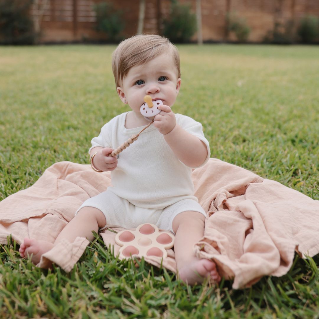 mushie press toy flowers rose