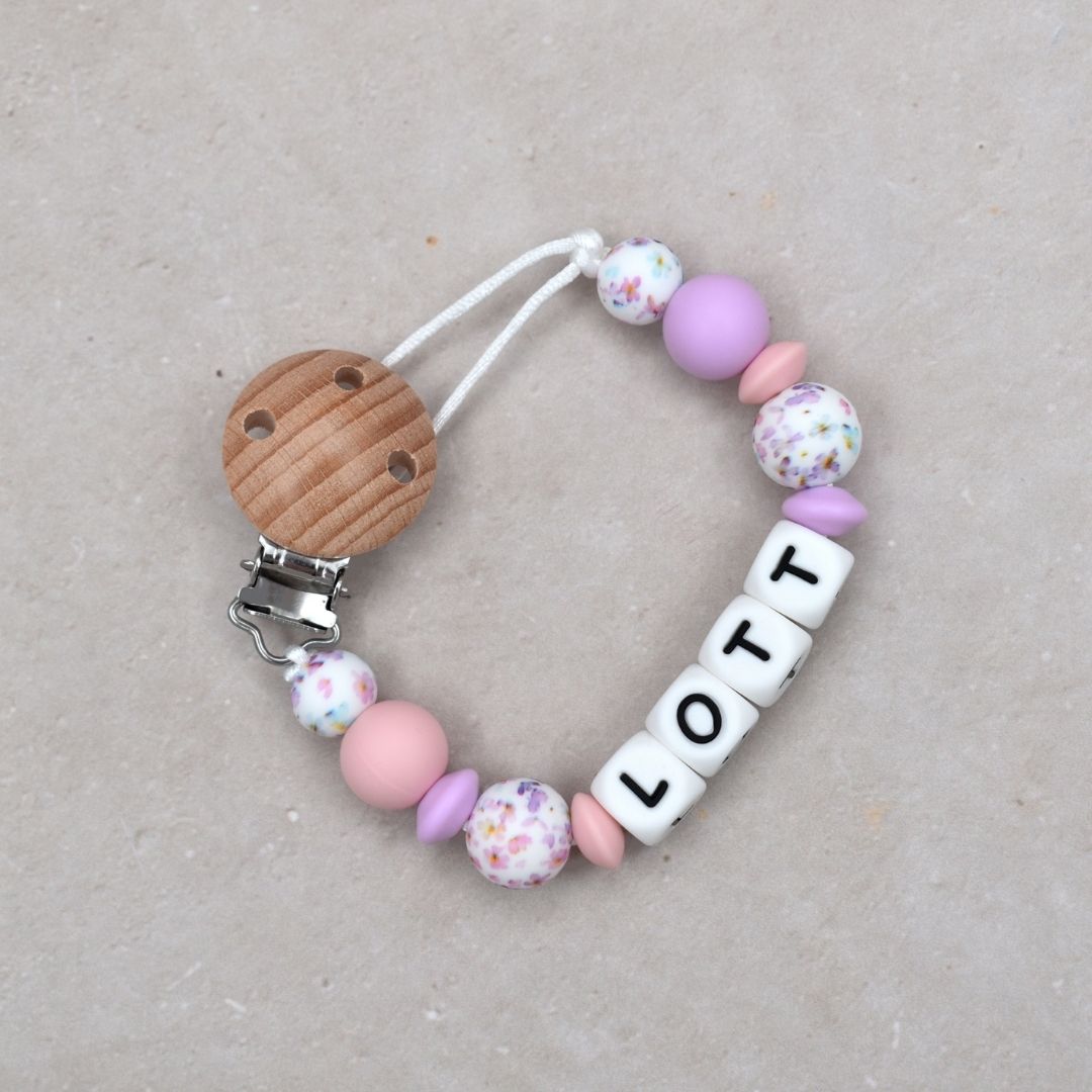 Fopspeenkoord met naam van Studio Bambacht in de kleur lila, roze en bloemen