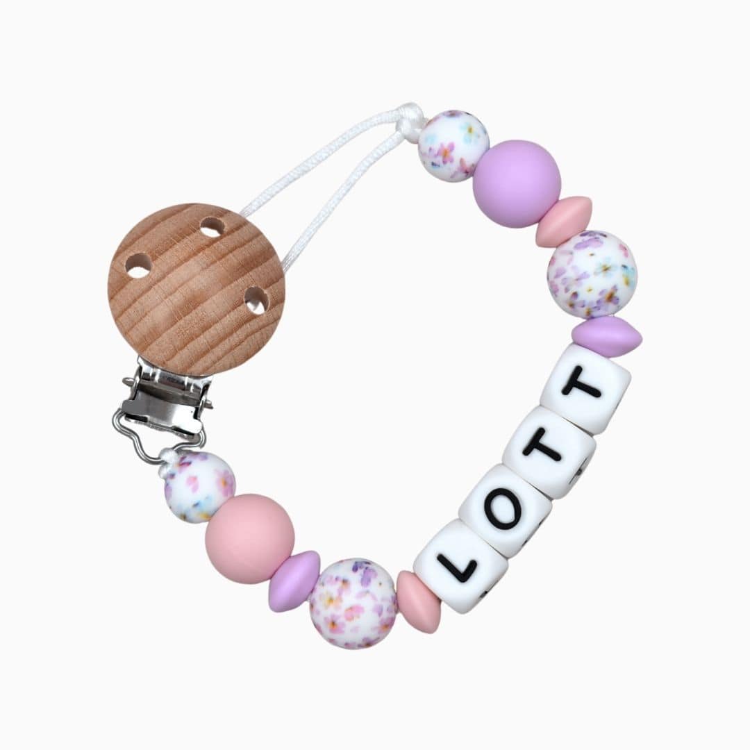 Speenkoord met naam van Studio Bambacht in de kleur lila, roze en bloemen