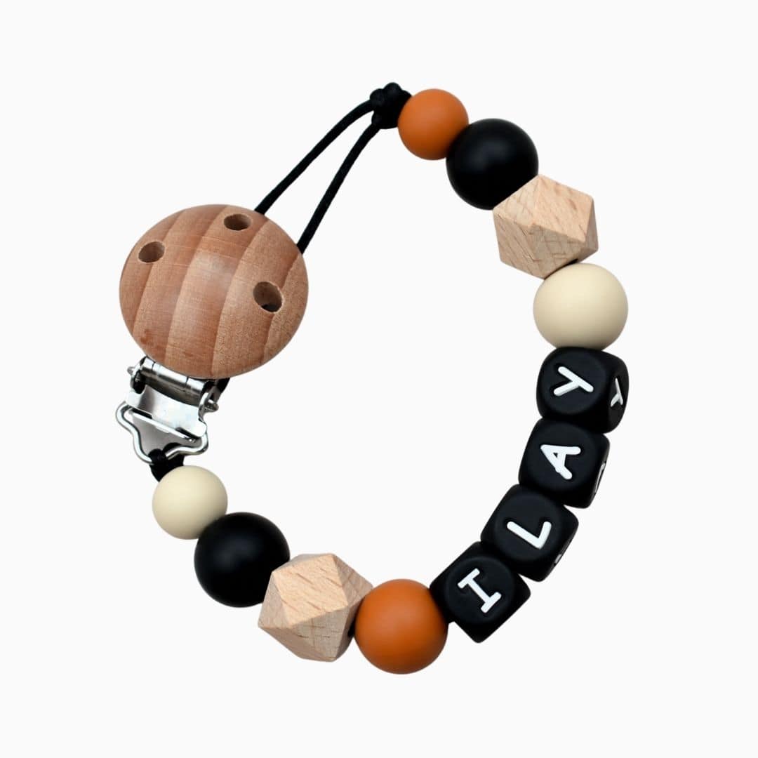 Speenkoord met naam van Studio Bambacht in de kleuren zwart, roest en beige