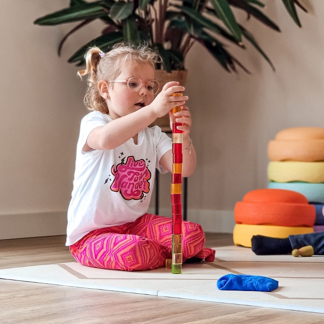 Bauspiel blokkenset met 64 licht doorlatende cilinder blokken van acryl in houten frame