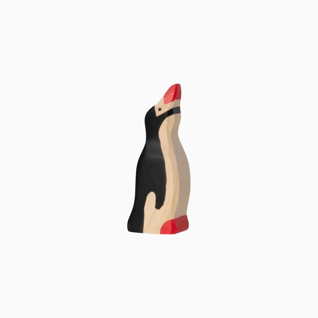 Holztiger baby pinguin met kop omhoog